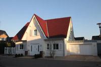 Landhaus in Putzbauweise mit Fensterlden / Klapplden in Stadtlohn, Friesengiebel,, Garage mit Zink - Umrandung