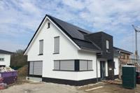 Modernes Haus mit Satteldach in Wallenhorst, 4-Giebel-Haus, Putz- Klinkerfassade, DF-Steine, Eckfenster, Erdwärme, PV-Anlage
